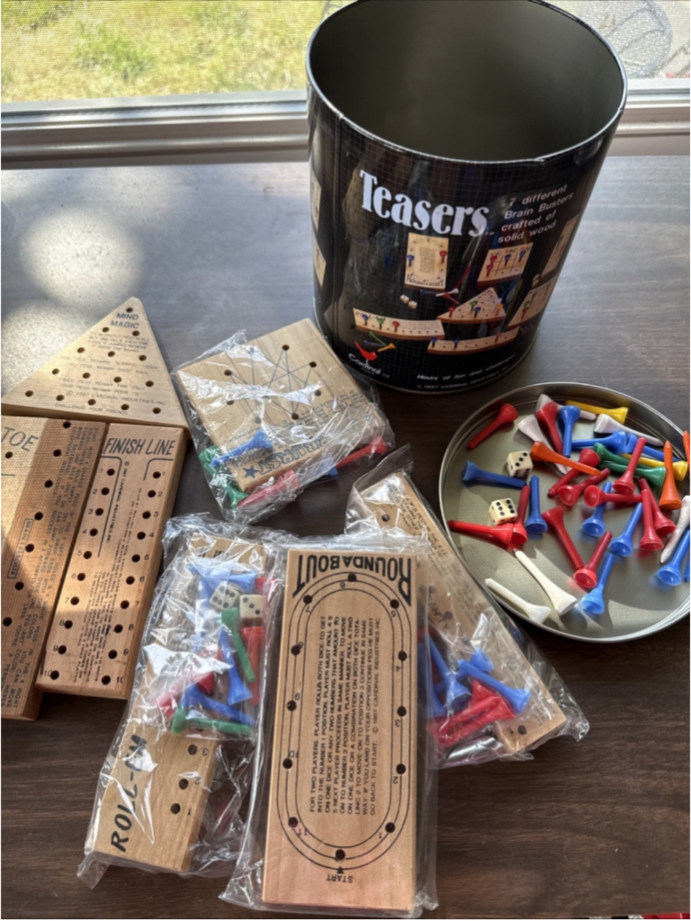 1980's Teasers 7 Different Brain Teaser Solid Wood Puzzles in Tin Metal Canister